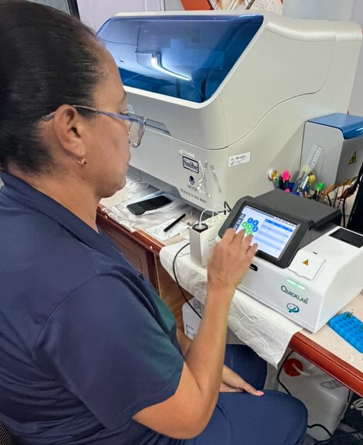 Ms. Alina Toledo, Clinical Laboratory Technologist, at one of our analysers